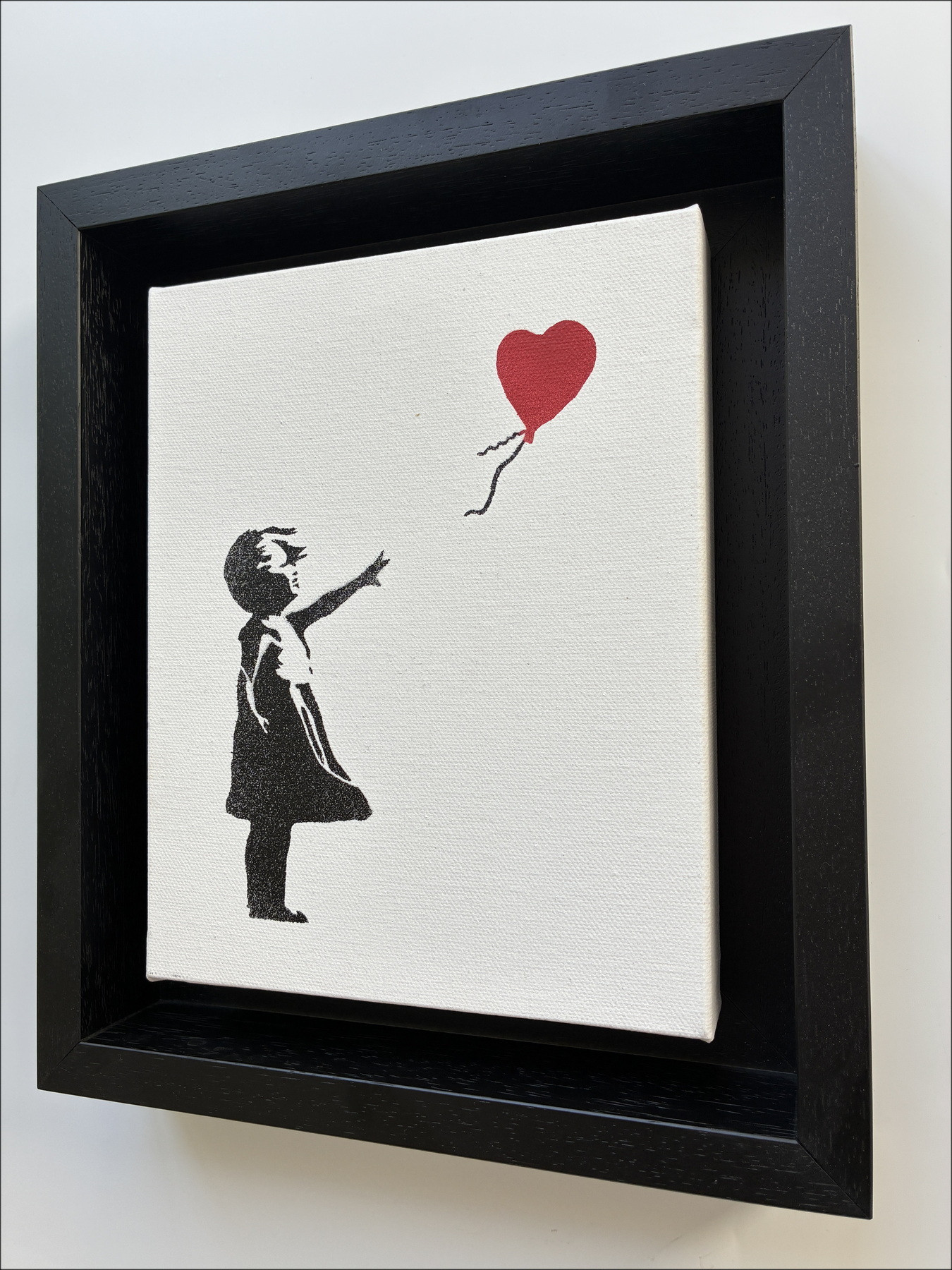 BANKSY La ragazzina con la palla sul tetto